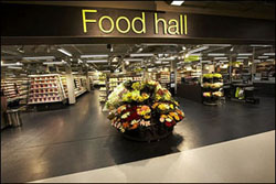Food halls, which provide a variety of fresh artisan foods, are replacing food courts according to Baum and Whiteman's report. 